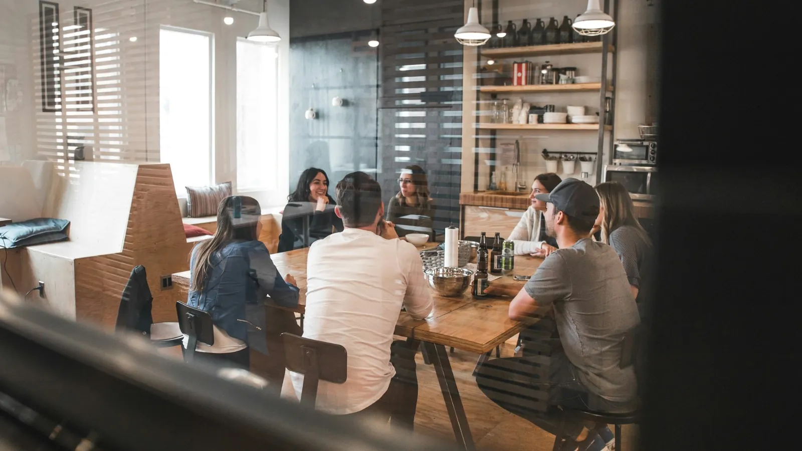 A small business team meeting around a table in their office